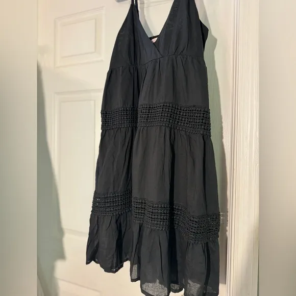 Black sundress fully lined with a smock backing and adjustable straps Size L NWT