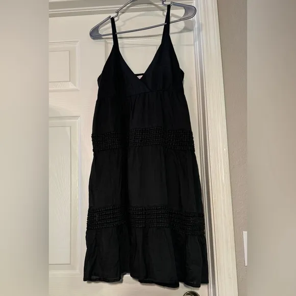 Black sundress fully lined with a smock backing and adjustable straps Size L NWT