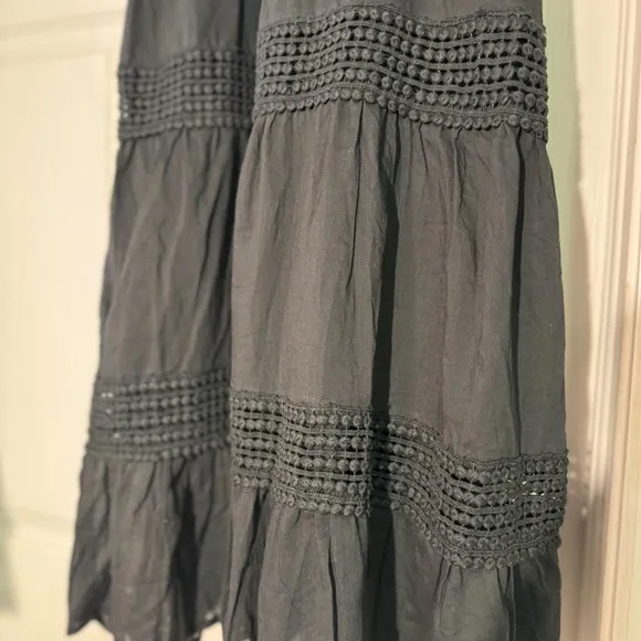 Black sundress fully lined with a smock backing and adjustable straps Size L NWT