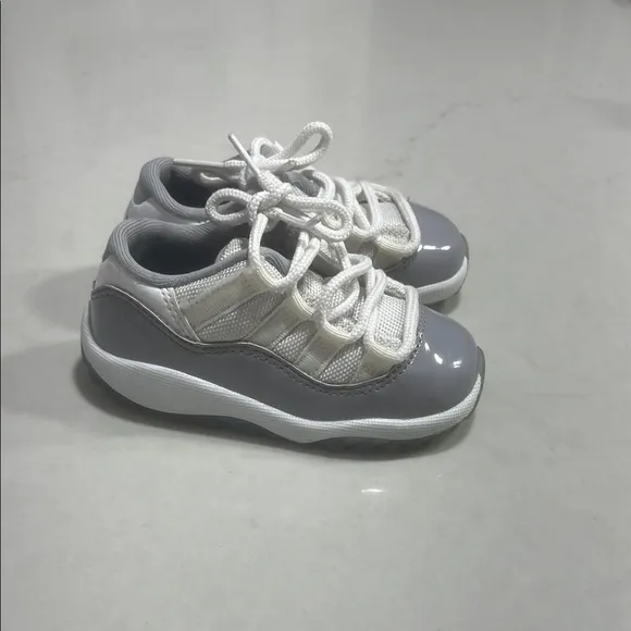 Gray and White Jordan 11 Low Sneakers