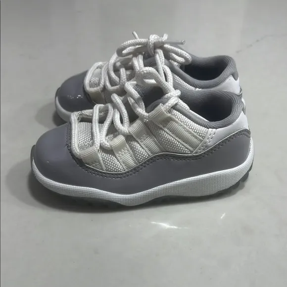 Gray and White Jordan 11 Low Sneakers