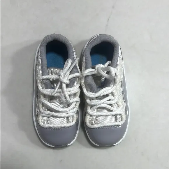 Gray and White Jordan 11 Low Sneakers