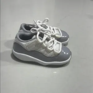 Gray and White Jordan 11 Low Sneakers