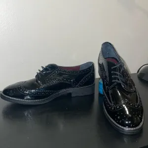 Line A Zeta Black patent leather wing tip shoes.  Size 37/6.5.