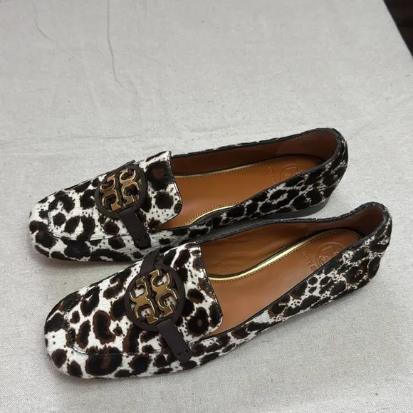 Tory Burch Leopard Patent Leather Black and White Flats with Gold Hardware.