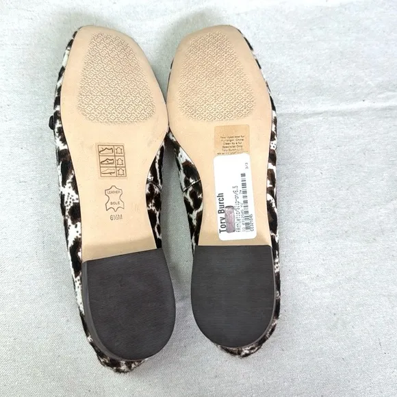 Tory Burch Leopard Patent Leather Black and White Flats with Gold Hardware.